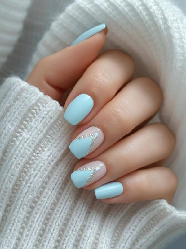 tiffany-blue-nails-with-design-with-sweater-sleeve-showing